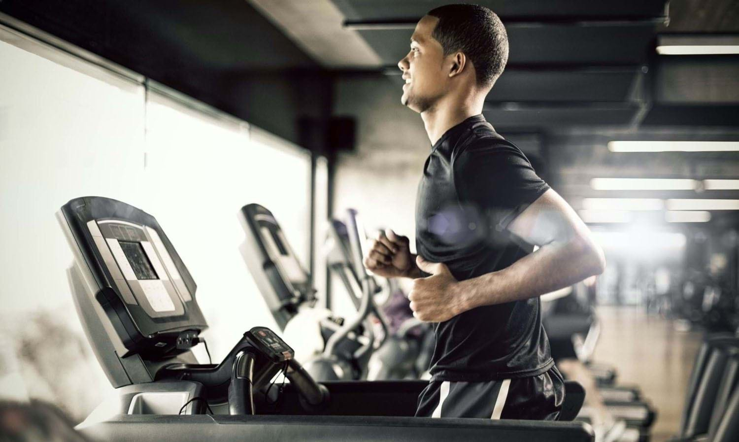 man running on treadmill