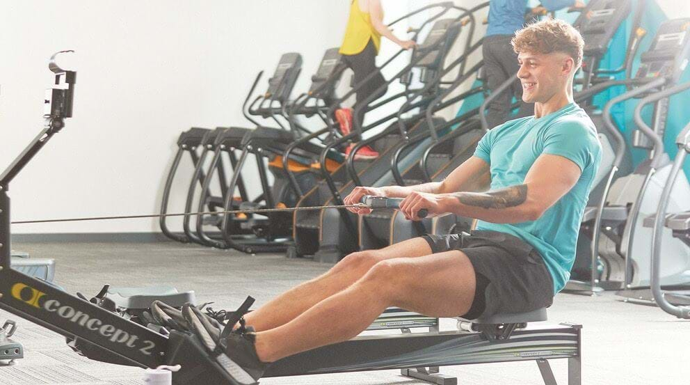 man on rowing machine