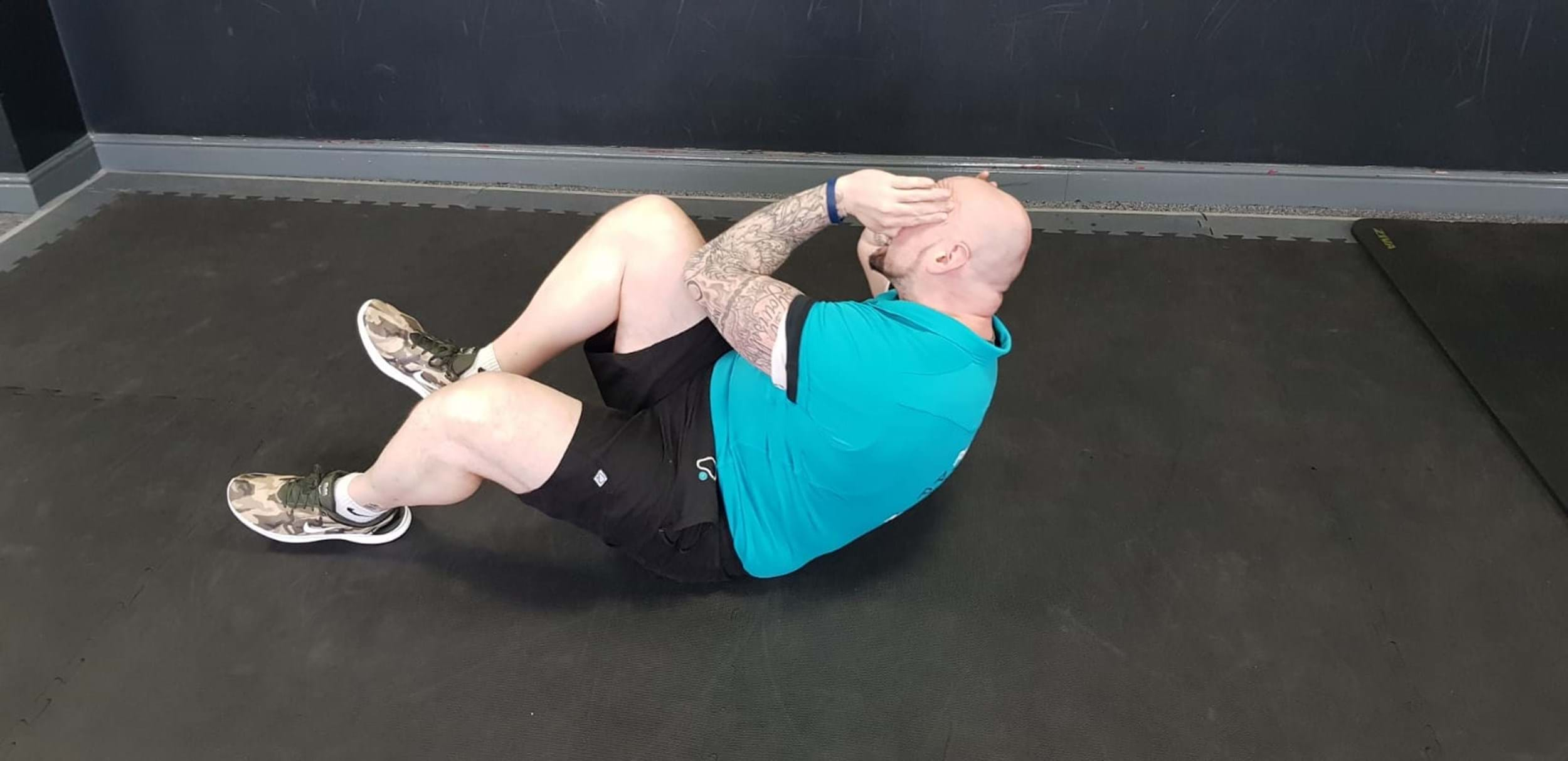 Lazy biker ab exercise end position