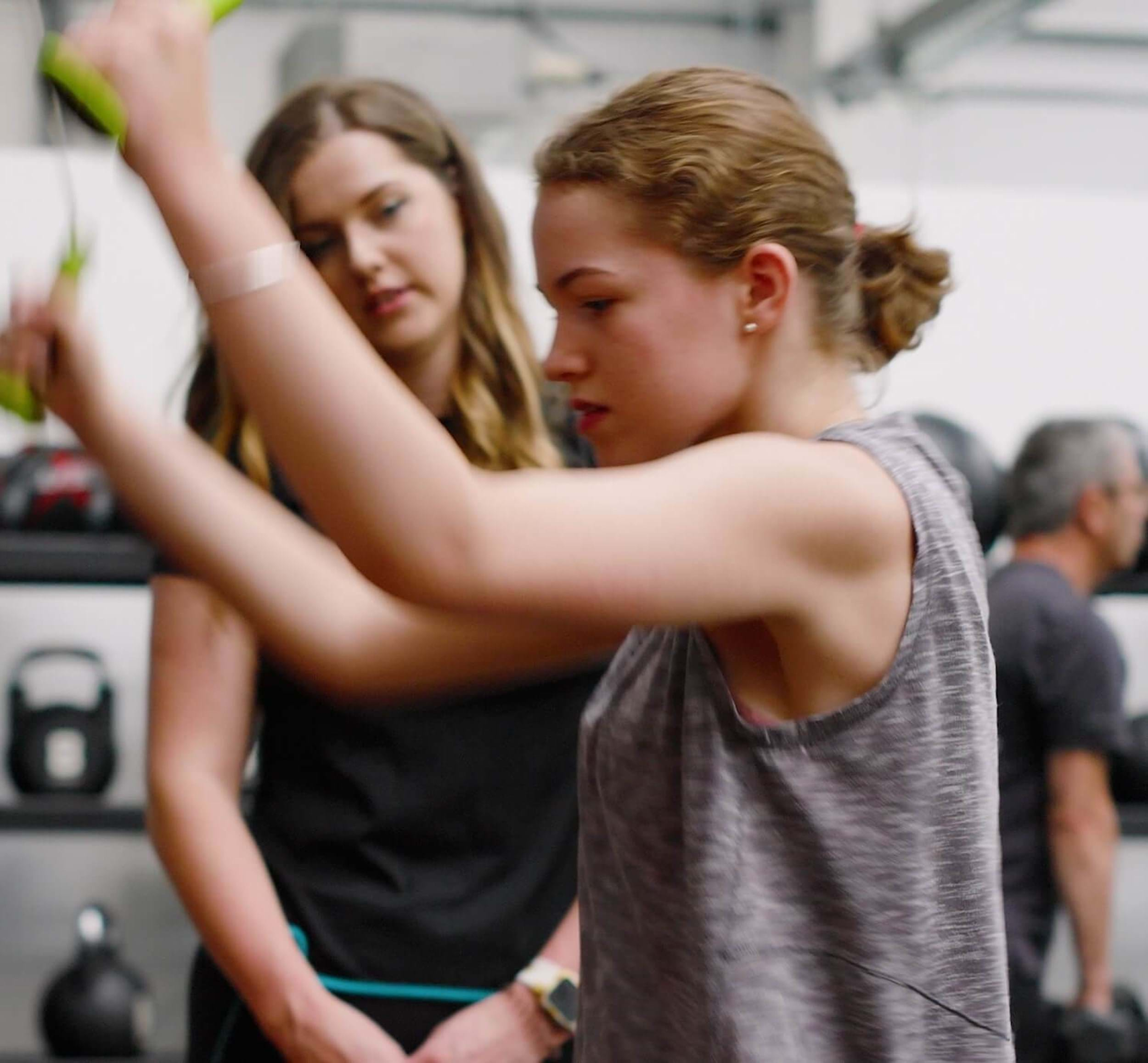 Charlotte, a PureGym member with cerebral palsy, training at the gym