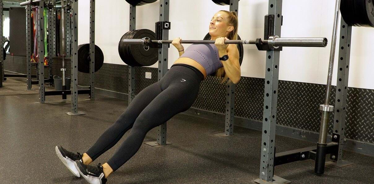 woman doing an inverted row